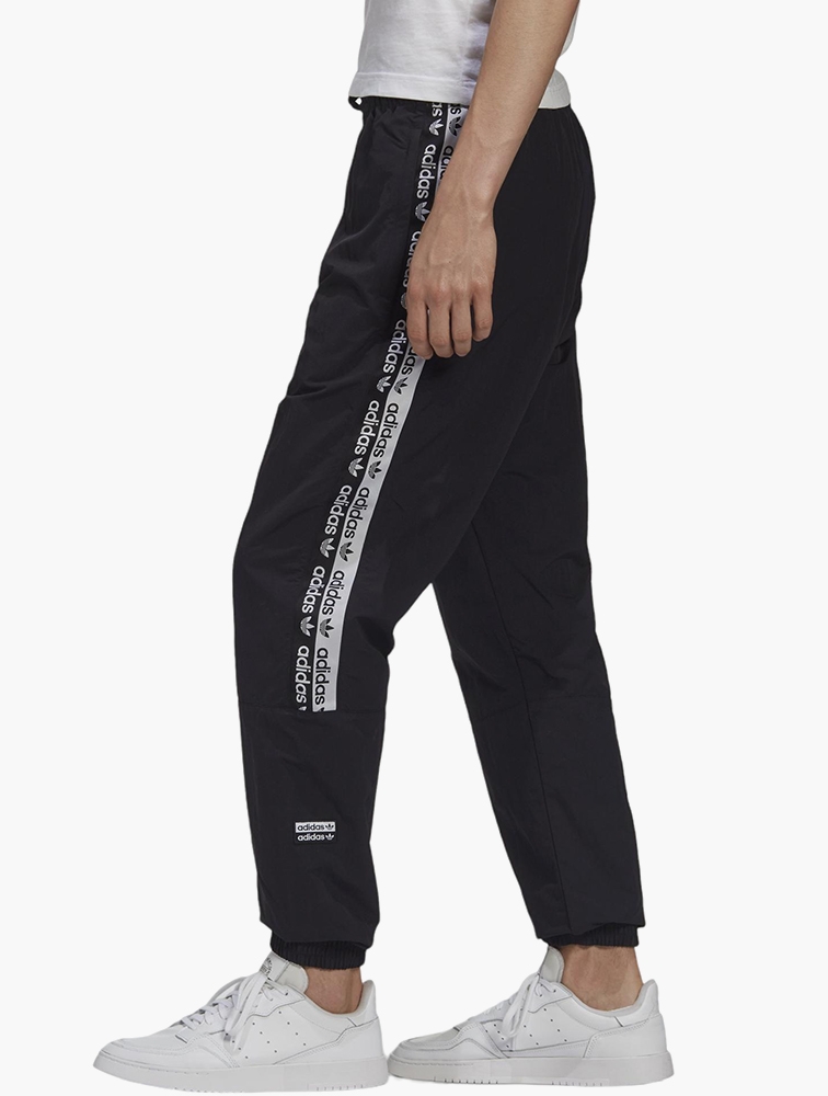 Adidas originals ryv taping hot sale track pants in black
